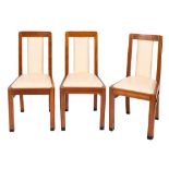 A set of six walnut and faux leather upholstered dining chairs in Art Deco taste,