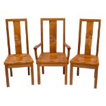 Stewart Linford of High Wycombe, an oak dining table and eight chairs en suite,