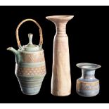 *Mary Rich [1940-2022] a porcelain teapot and two vases: the former of slender barrel shaped form