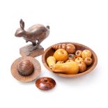 A contemporary carved wood model of a running hare: mounted on a rectangular base,