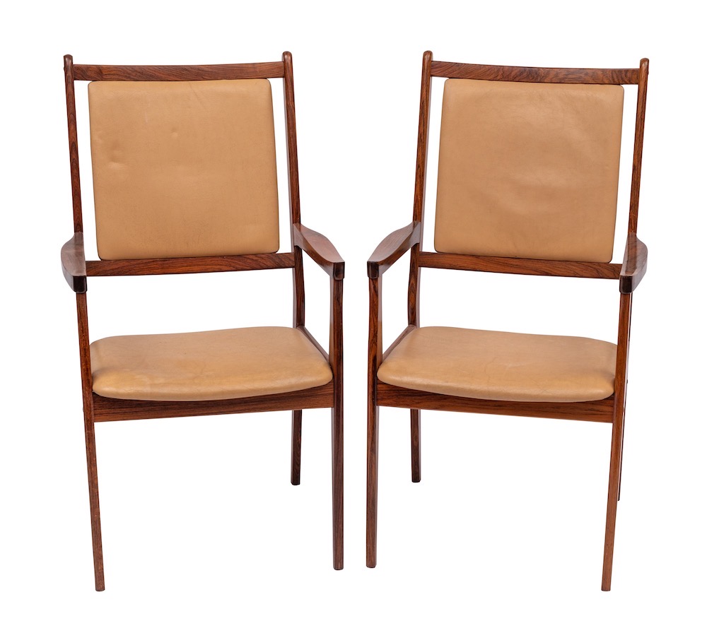 WITHDRAWN A pair of Scandinavian rosewood open armchairs: the cream rexine