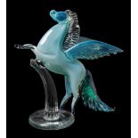 A Murano glass figure of Pegasus: the clear and pale blue beast in rearing posture with fanned tail