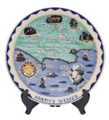 A Poole Pottery Hardy's Wessex charger: decorated with a map, local views and a profile portrait,