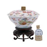 A Chinese famille rose 'dragon' bowl and cover: of ogee form with pierced square-section finial,