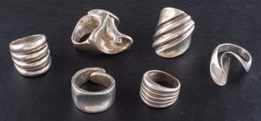 Six modernist rings,: five rings stamped '925', ring sizes K-P, total weight ca. 84.2gms (6).