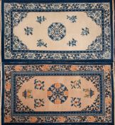 A Chinese rug:, the ivory field with a central circular palmette scroll medallion,