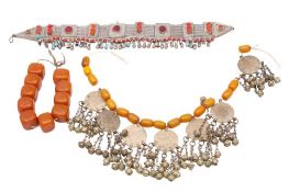 A Middle Eastern silver coin and amberoid bead necklace: with imitation Marie Theresa Thaler coins,