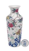 A Chinese porcelain famille rose vase: of shouldered cylindrical form with flaring neck enamelled