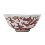 A Chinese copper-red dragon bowl: the first with flared rim,