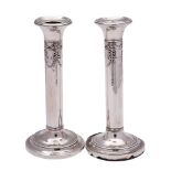 A pair of Edward VII silver candlesticks, maker Henry Matthews, Birmingham,