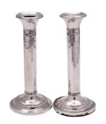 A pair of Edward VII silver candlesticks, maker Henry Matthews, Birmingham,
