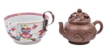 A Chinese famille rose pouring cup and a small Yixing teapot and cover: the cup with pointed spout