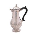 A Victorian silver coffee pot, maker Hawksworth, Eyre & Co, Sheffield, 1879: crested,