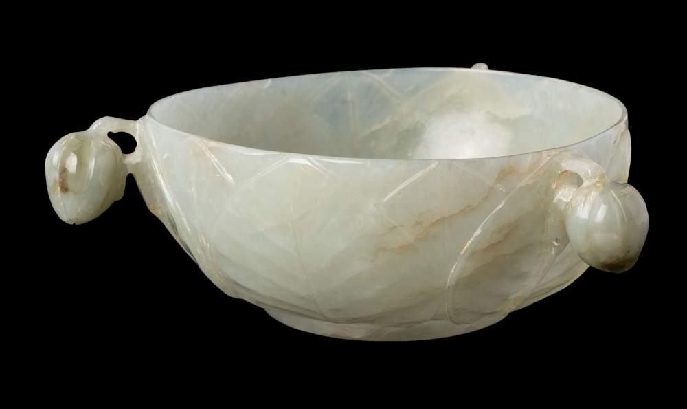 A fine Chinese Mughal-style celadon jade bowl: the exterior with three bud handles suspended from