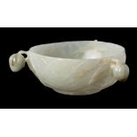 A fine Chinese Mughal-style celadon jade bowl: the exterior with three bud handles suspended from