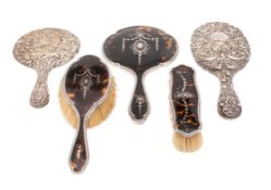 A George V silver three piece tortoiseshell and silver dressing table set, maker Elkington & Co,