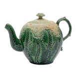 A Staffordshire creamware 'cauliflower' teapot and cover: with foliate scroll handle,