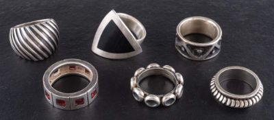Six modernist rings,: one signed 'Quinn', ring sizes N-T, total weight ca. 74.3gms (6).