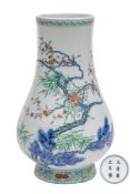 A Chinese doucai pear shaped vase: painted with the 'Three Friends of Winter' of prunus,