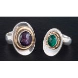 Two gemset rings,: including emerald and star sapphire, length of ring heads ca. 2.