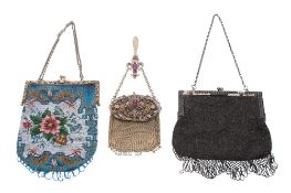 A Victorian glass beadwork purse: a Victorian black beadwork purse and a continental filligree and