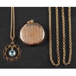 Two early 20th century pendants,: including a circular locket pendant with engine-turned decoration,