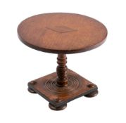 An apprentices mahogany miniature table: the circular tilt-top with lozenge medallion,