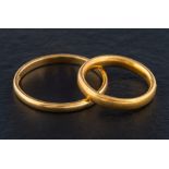 Two 22ct gold band rings,: one with hallmarks for Birmingham, 1937,