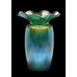 A Loetz 'Goldiris' glass vase: of vertically ribbed barrel shaped form with flaring wavy rim, 21.