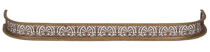 A rare Regency brass and pierced steel fender: pierced and engraved with foliage and scrollwork