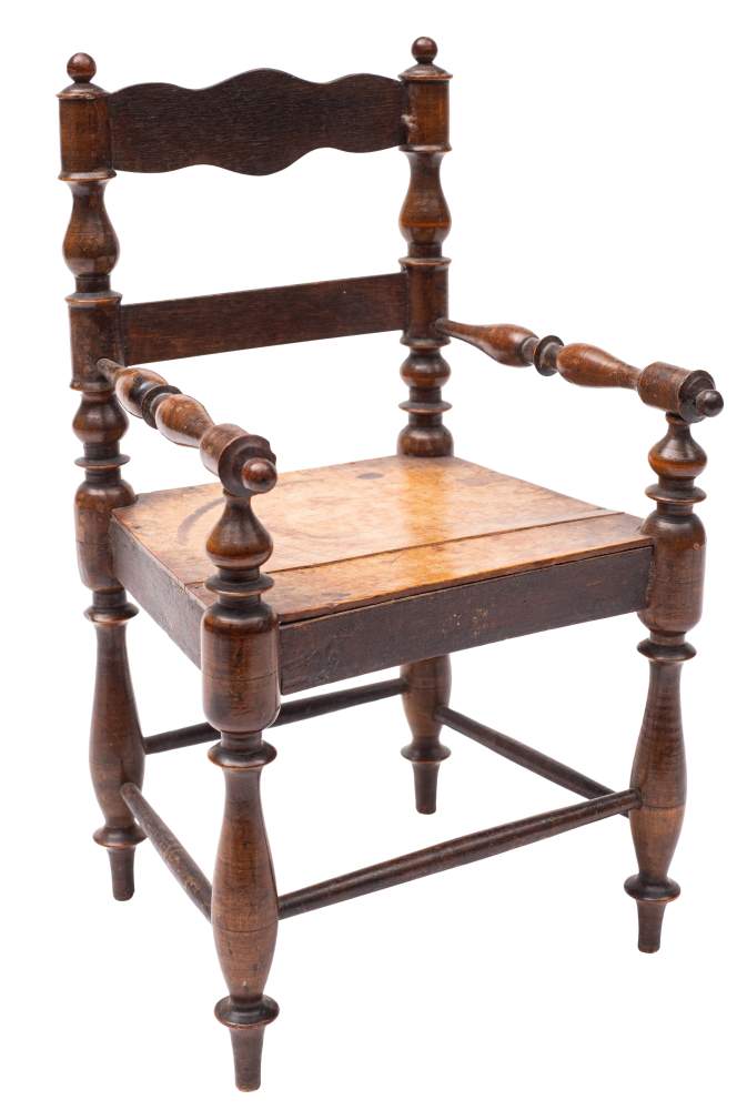 A late 19th century apprentice's miniature elbow chair: with shaped top rail between spindle