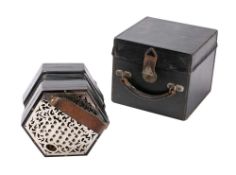 A forty-six key MacCann duet system concertina: with steel cut fret ends, six division bellows,