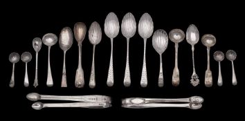 A mixed group of silver spoons and sugar tongs,