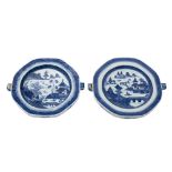 A matched pair of Chinese blue and white octagonal warming dishes: painted with traditional pagoda