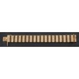 A 9ct gold gate-link bracelet,: with import marks for London, 1965, length ca. 18.