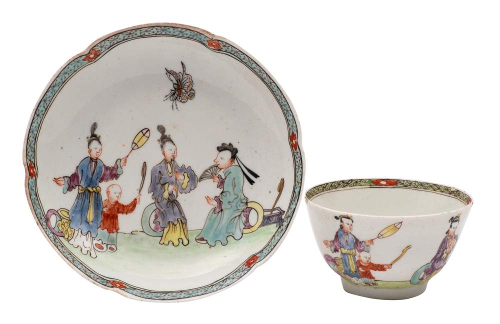 An early First Period Worcester famille rose matched tea bowl and saucer: painted with a family