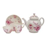 A First Period Worcester teapot and cover and a matched trio: painted in puce monochrome with