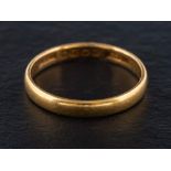 A 22ct gold band ring,: with hallmarks for Birmingham, 1936, ring size L, total weight ca. 2.6gms.
