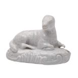 A Plymouth white model of a recumbent ewe: on scrollwork mound base, 9cm (part of one leg lacking).