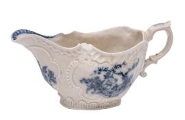 A large Plymouth blue and white sauceboat: with moulded foliate borders and cartouches,