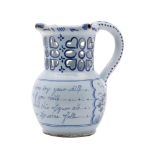 A Liverpool polychrome delftware puzzle jug: of conventional form with pierced cylindrical neck and