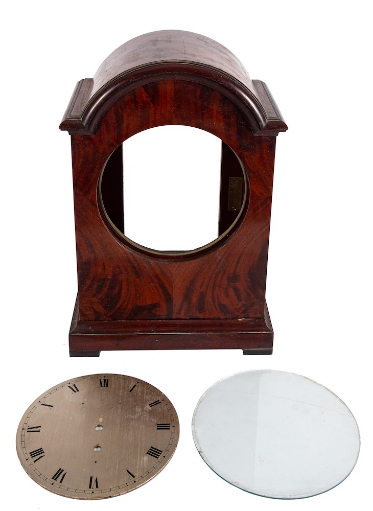 A substantial mahogany bracket clock case and round silvered dial: with brass bezel and glass,