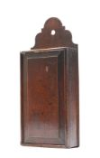 A George III oak candle box: of rectangular outline with pierced cresting and sliding panelled