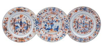 A group of three Chinese Imari plates: comprising a close pair and a single plate,