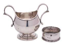 A George V silver twin handled basin, maker Blackmore & Fletcher, London,