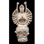 A large Chinese blanc-de-chine figure of Doumu: the goddess wearing a Buddhist crown and holding