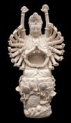 A large Chinese blanc-de-chine figure of Doumu: the goddess wearing a Buddhist crown and holding