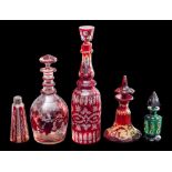 A mixed lot of Bohemian ruby and green glass: comprising a decorated green glass octagonal scent