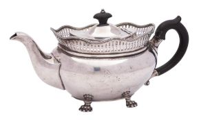 A George V silver teapot, maker Sibray Hall & Co London, 1917: of oval outline with galleried rim,