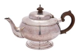 A George V silver bachelor's teapot, maker's mark worn, London, 1931: of plain circular form,